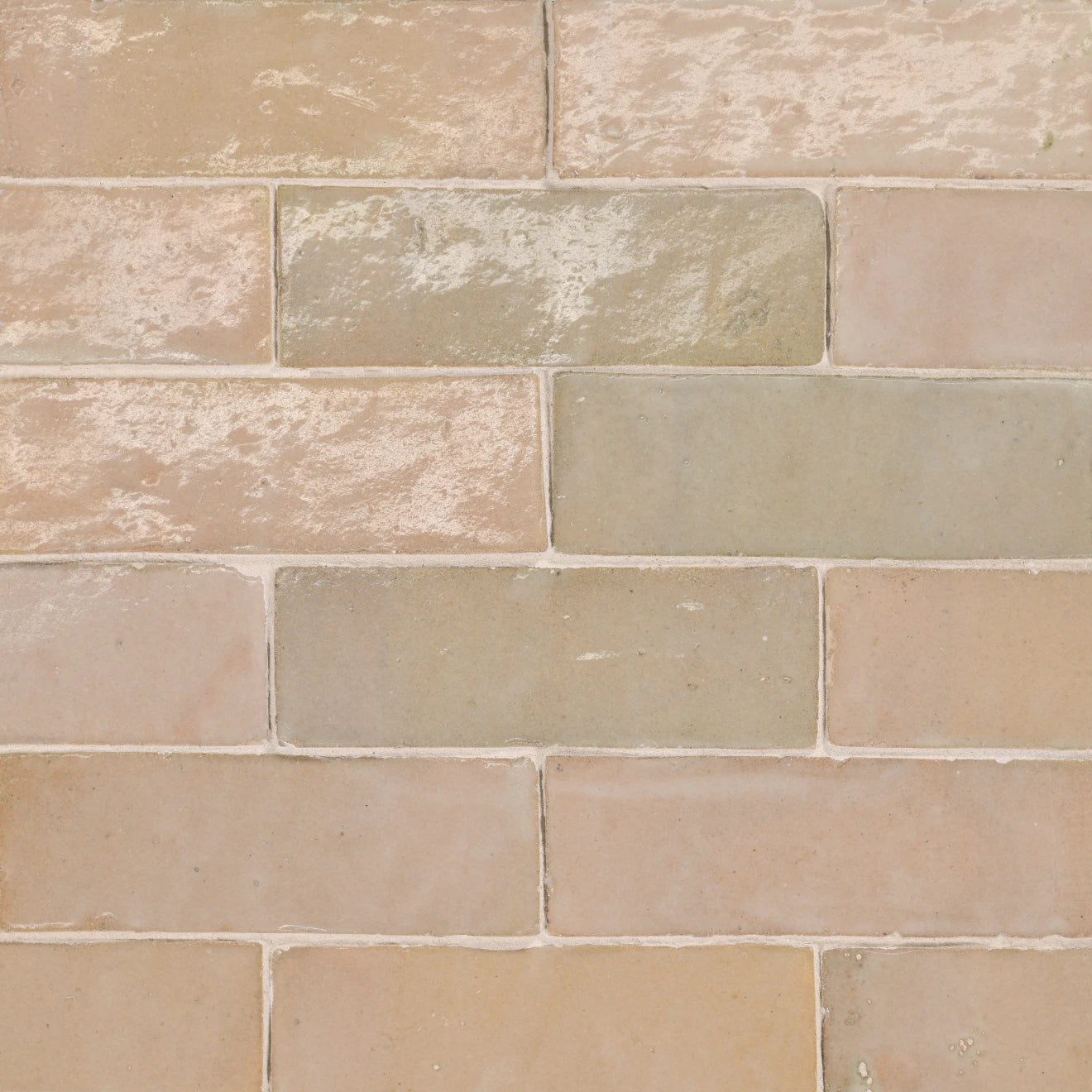 A closeup of shiny peach toned tile.
