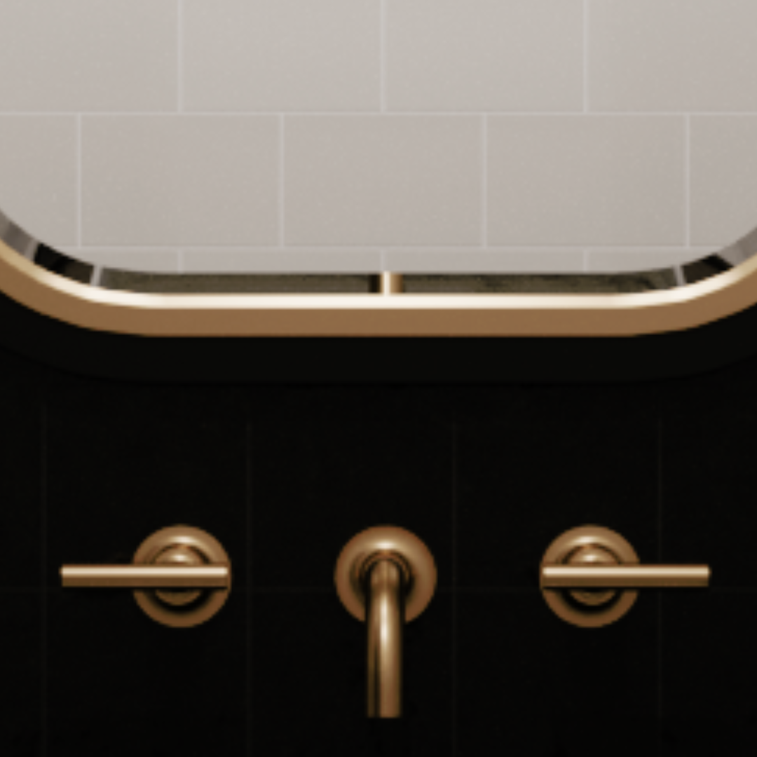 Brass mirror edge and brass wall-mount faucet on a black wall