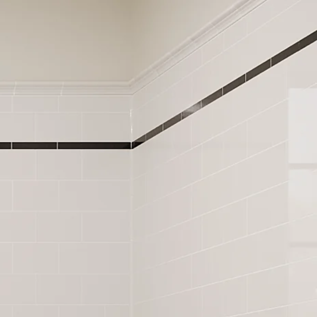 The corner of a tiled bathroom.