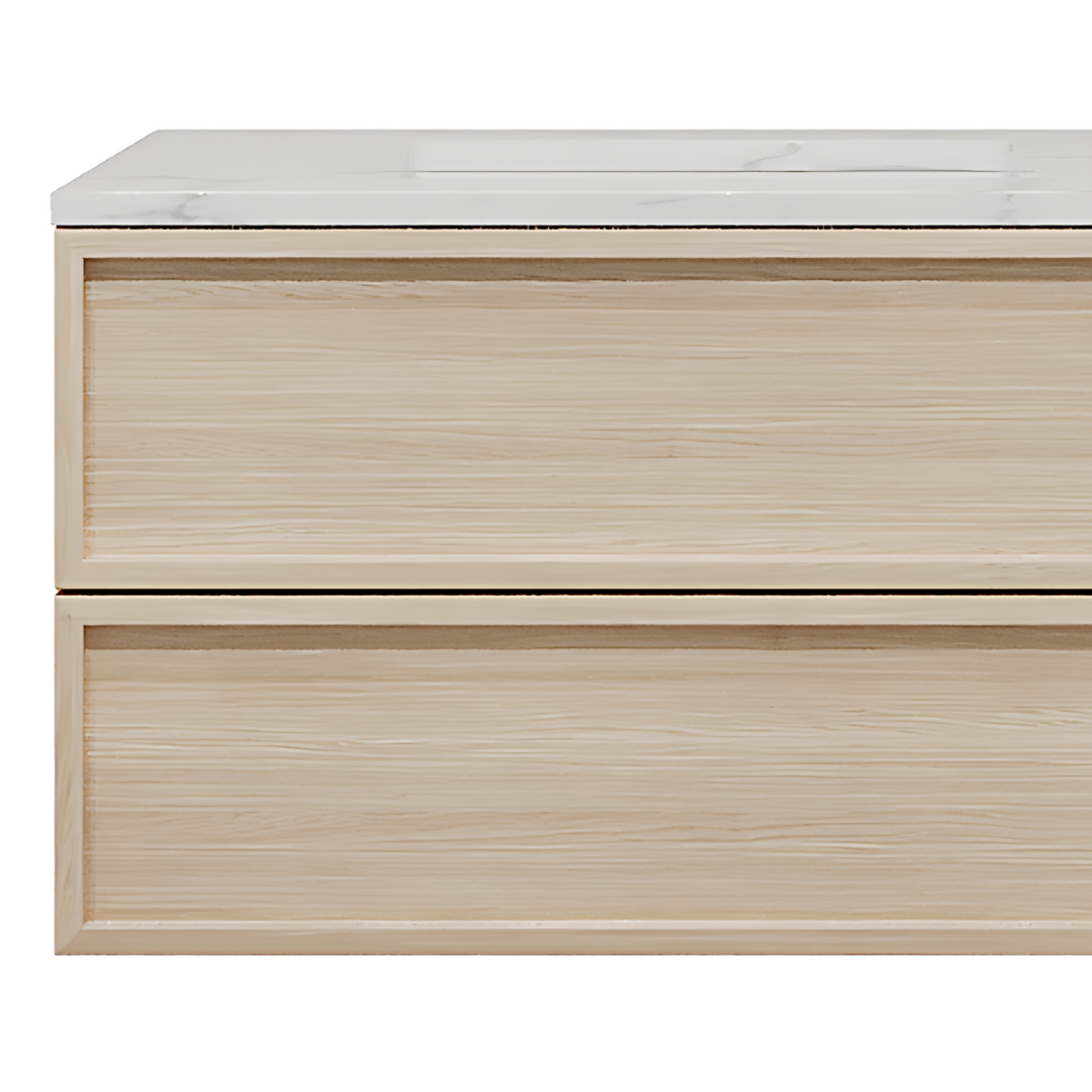 A wooden vanity with a marble surface.