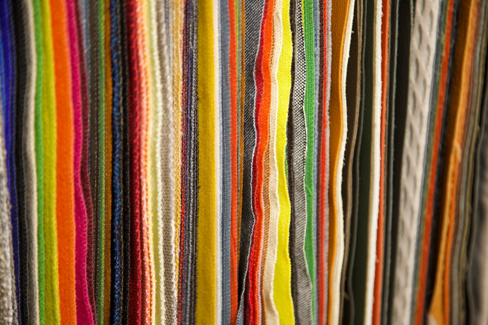 A close up of a row of colorful fabric.