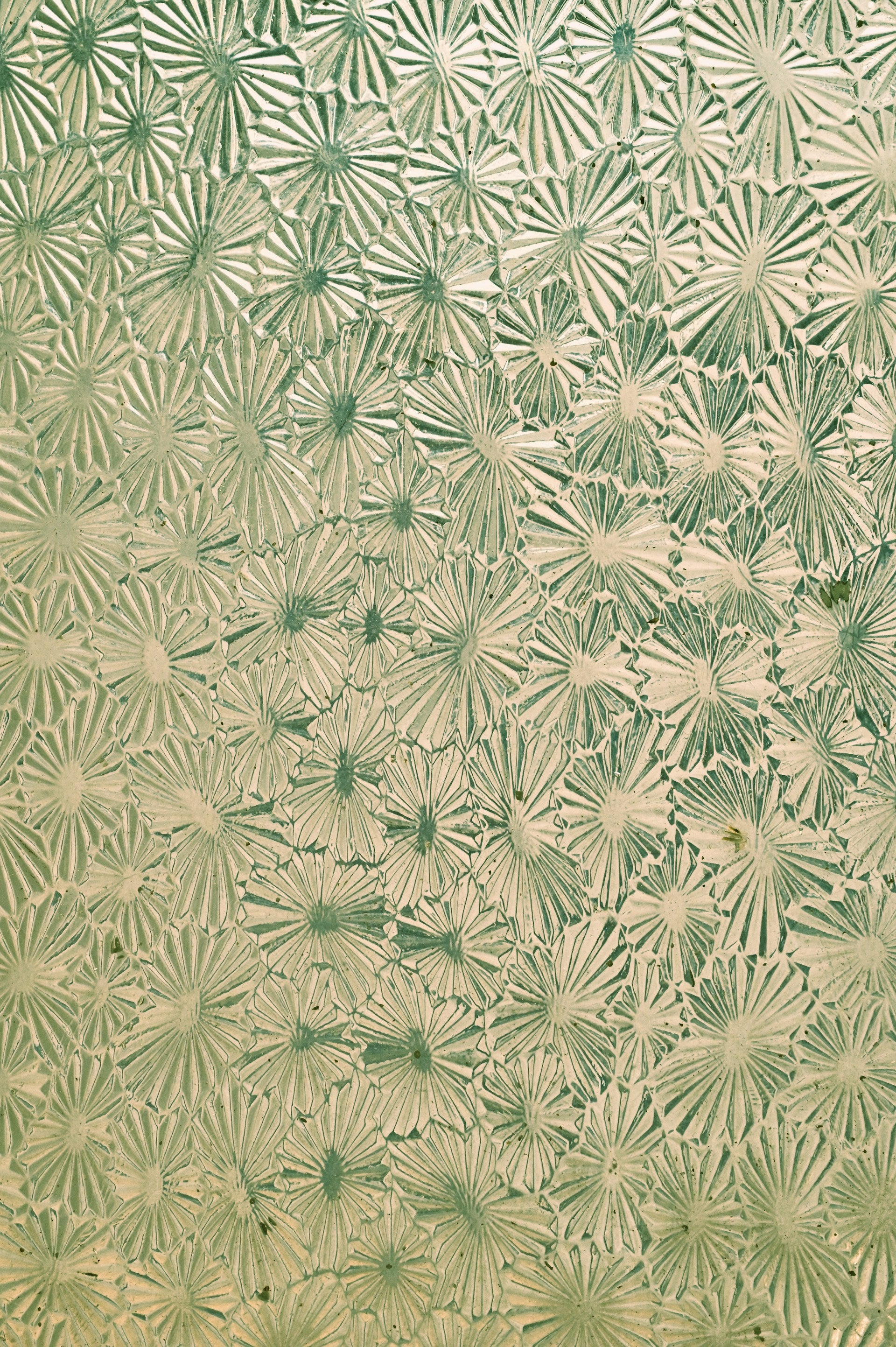 A gold surface with a floral pattern.