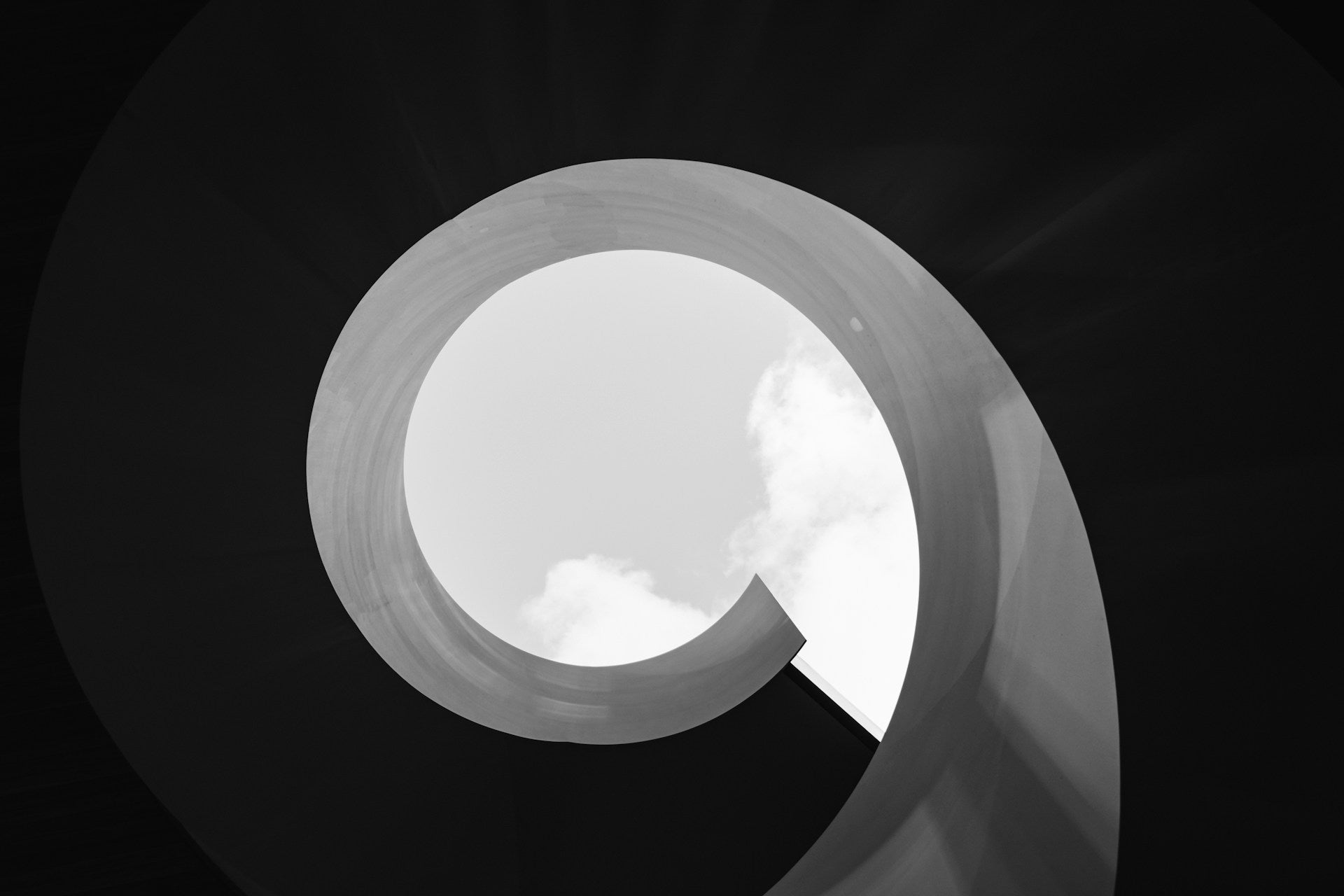 A black and white photo of a spiral structure.