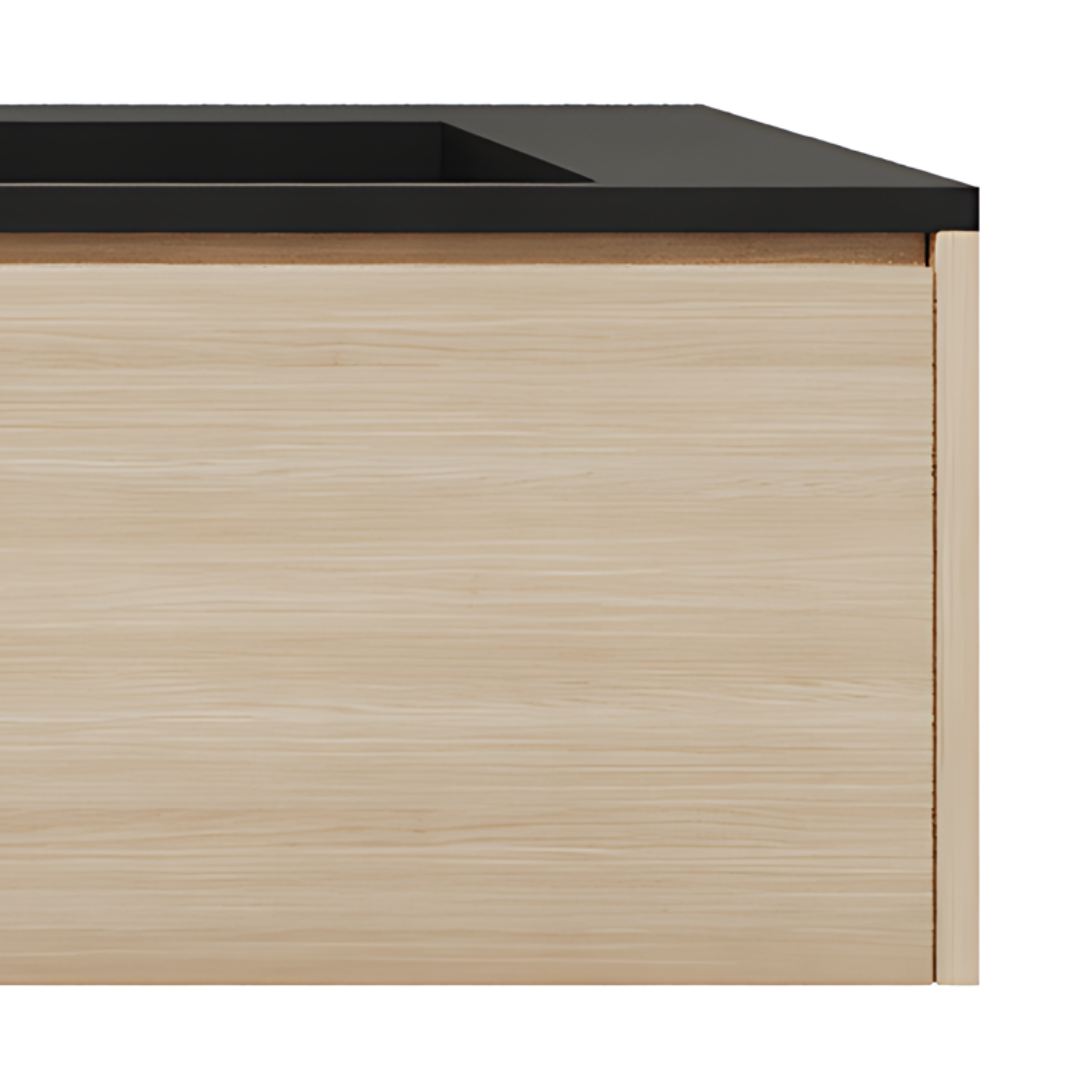 A wooden vanity with a black surface.