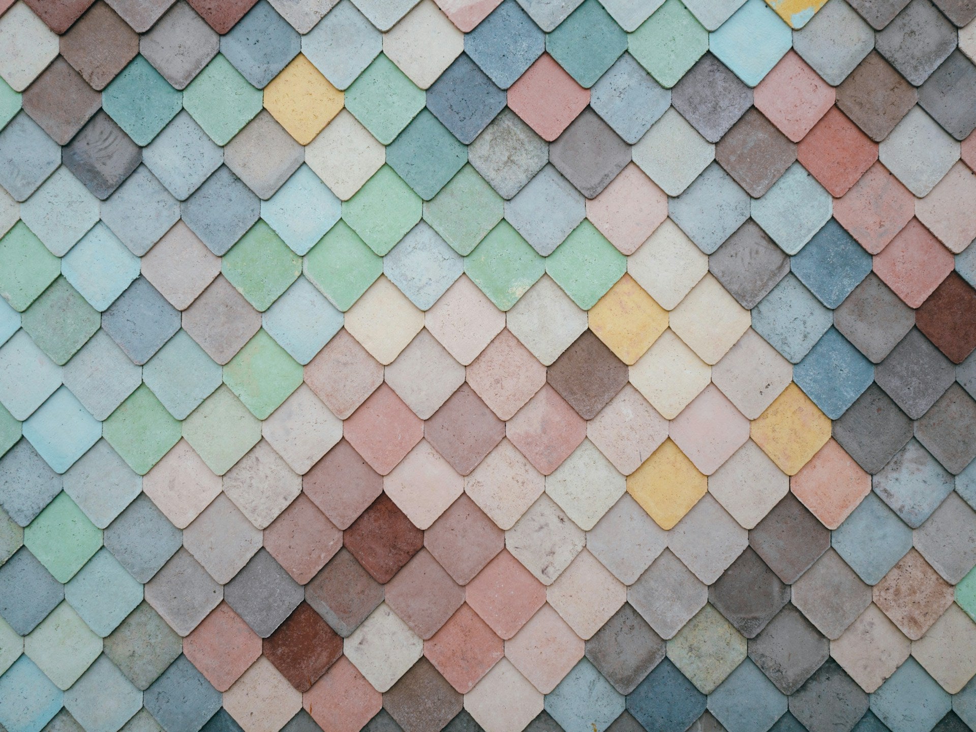 Layered pieces of colorful tiles.