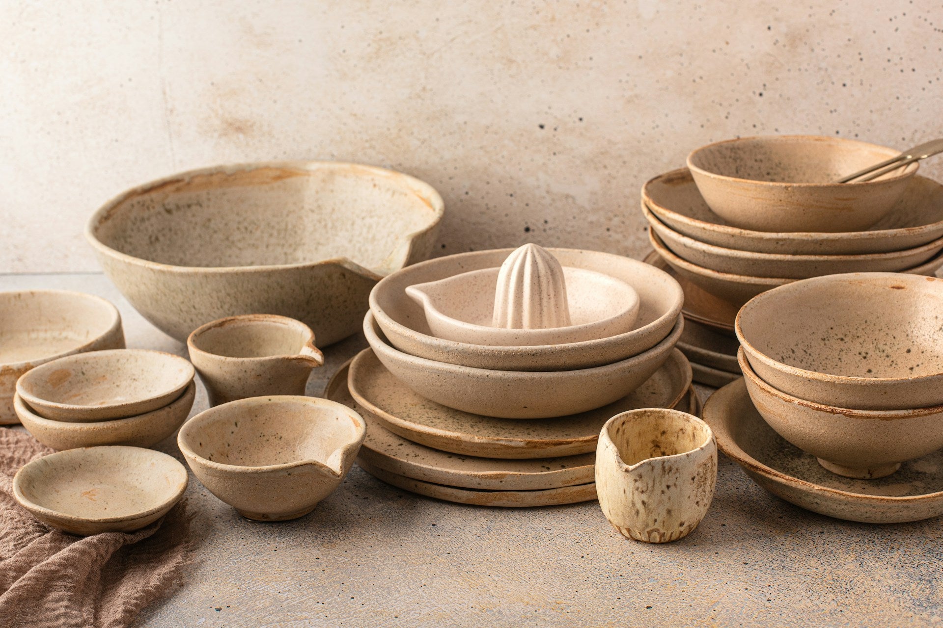An assortment of bowls and dishes sitting on a table.