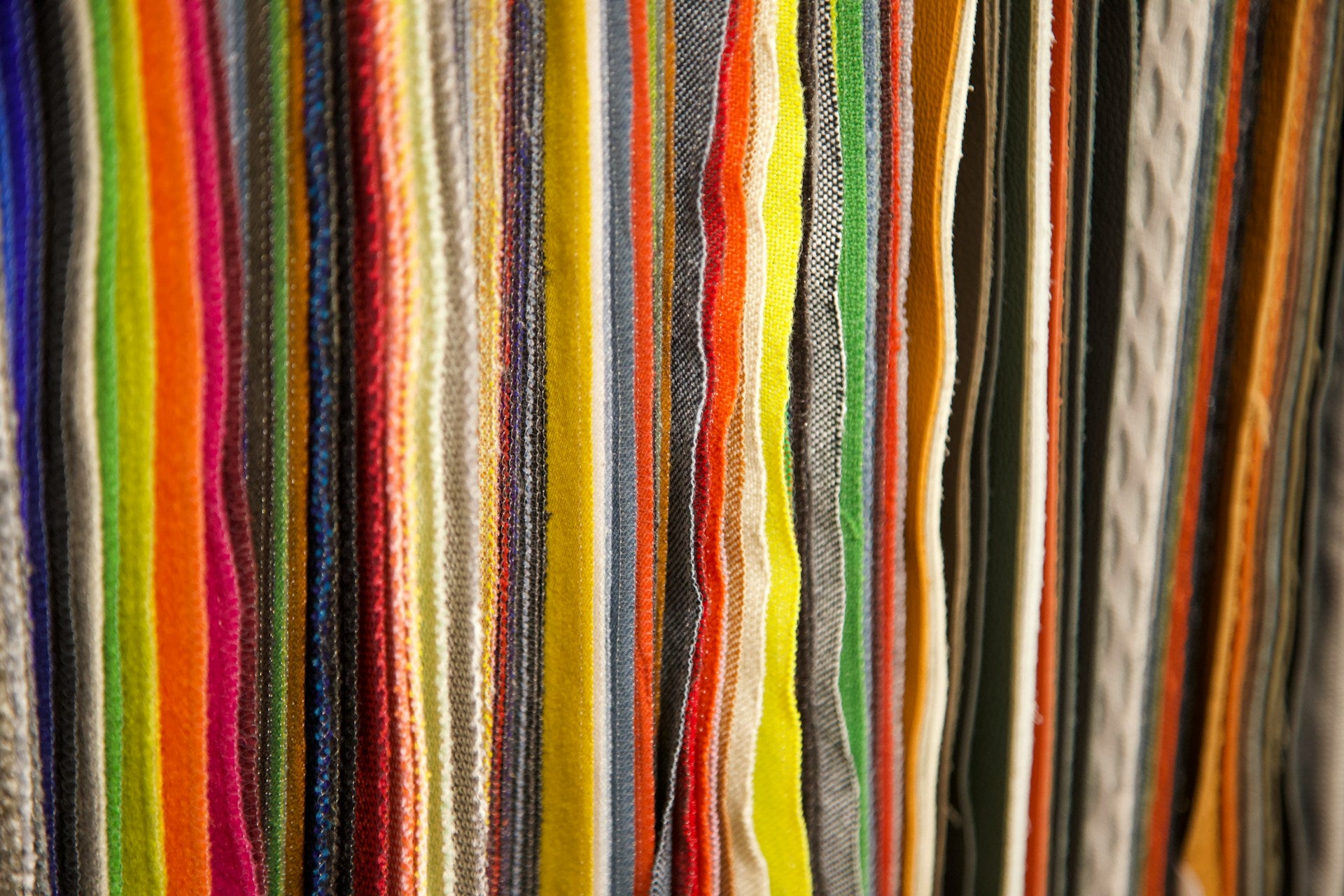 A close up of a row of colorful fabric.