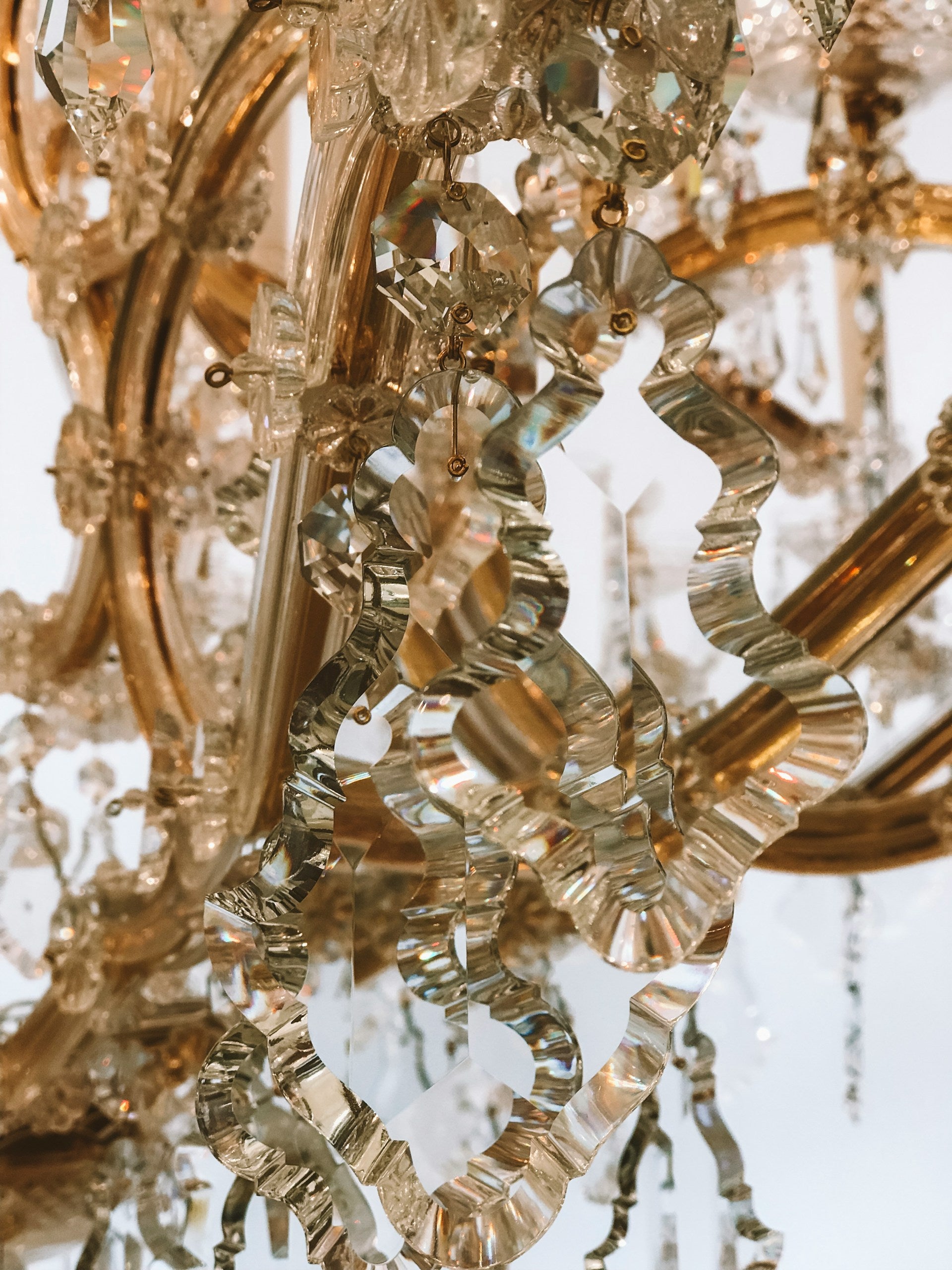 A gold and crystal light fixture.