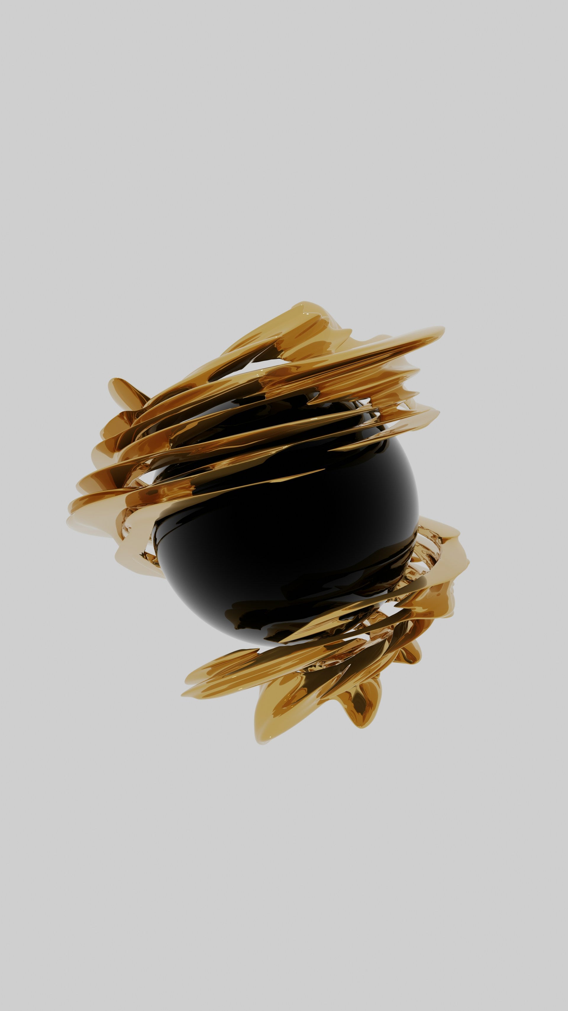 A round black and gold object in front of a white background.